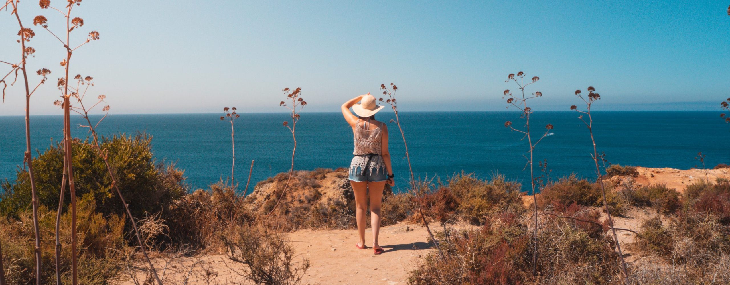 A female in Ponta da Piedade, a scenic spot in Portugal